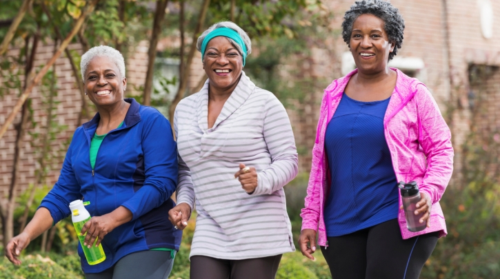 A group of women walking on the street.