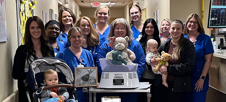 Members of Grayson’s Footprints Foundation and Piedmont Cartersville staff mark the introduction of the 'Caring Cradle'.